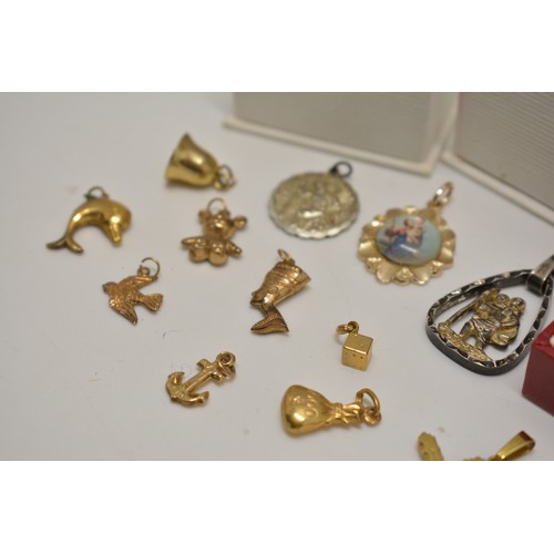 305 - Various gold charms (x12) with necklace stamped 10k, crucifix pendant marked 14ct and other mixed me... 