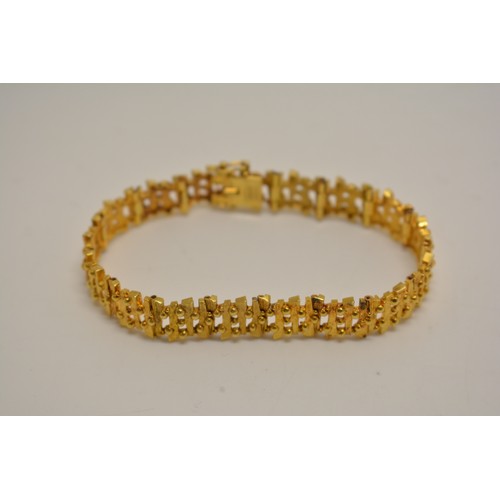 309 - Yellow gold bracelet by D Shackman & Sons, textured link design, hallmarked London 1974 to clasp . A... 