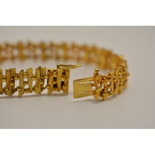 309 - Yellow gold bracelet by D Shackman & Sons, textured link design, hallmarked London 1974 to clasp . A... 