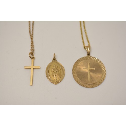 335 - 9ct yellow gold circular pendant with an engraved cross to central design, a St Christopher hallmark... 