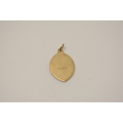 335 - 9ct yellow gold circular pendant with an engraved cross to central design, a St Christopher hallmark... 