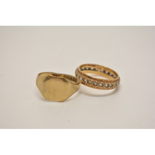 336 - 9ct yellow gold signet ring (2.3g) and 9ct full eternity ring with clear stones (2.4g). Box included... 