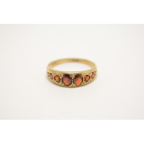 338 - x2 9ct yellow gold rings -  gem set ring with graduating garnets, together with one other tri stone ... 