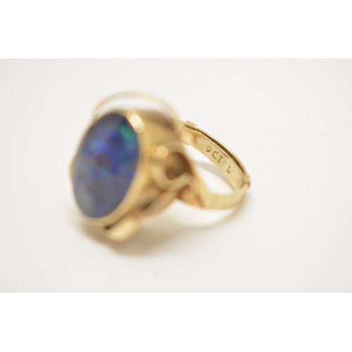 339 - 9ct gold ring stamped 9ct with scroll design to mount, central raised stone believed to be Australia... 