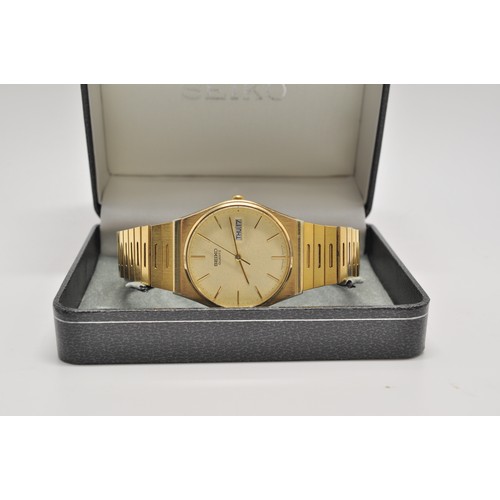 348 - Mens Seiko quartz  watch gold tone  with date window, Japan 6533 - 8000 T , steel back, serial no. 4... 