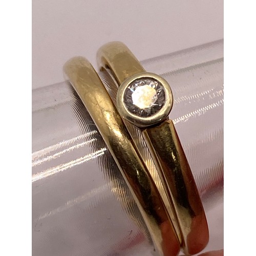 299A - x2 Rings - 9ct gold solitaire diamond ring, together with co-ordinating gold ring with x3 diamonds i... 