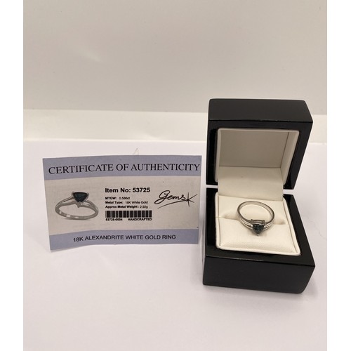 297A - 18K Alexandrite white gold ring, with box and certificate, approx size N. Approx metal weight 2.92g.