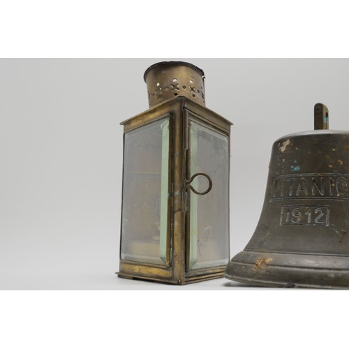 23 - Vintage bell marked Titanic 1912, antique oil lantern in glazed case together with patinated statue ... 