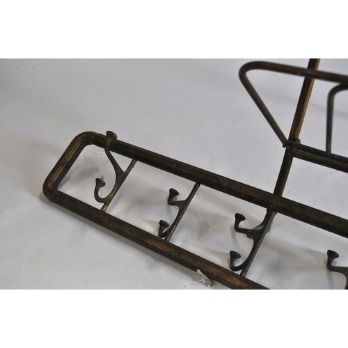 61 - Maison Jansen style folding newspaper rack, together with wall hanging swivelling hook coat rack