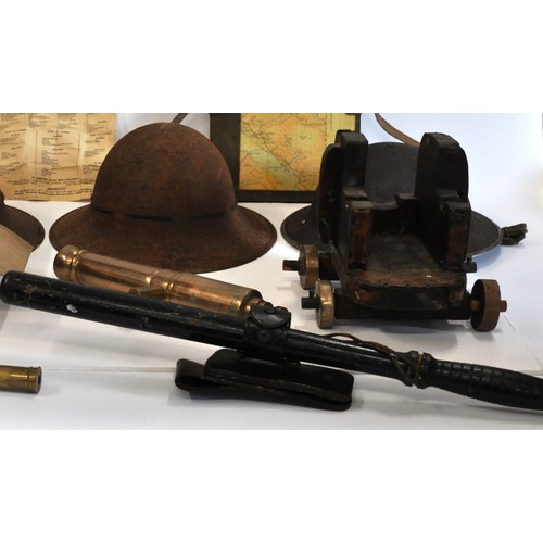 65 - Military-style steel helmets (x3), together with a small French telescope, ebonised truncheon in hol... 