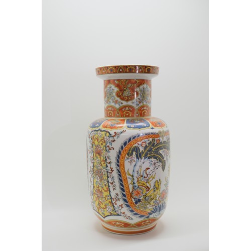 76 - Glazed Chinese vase with dancing foo dog design, mark EKEN to base. Approx H40cm