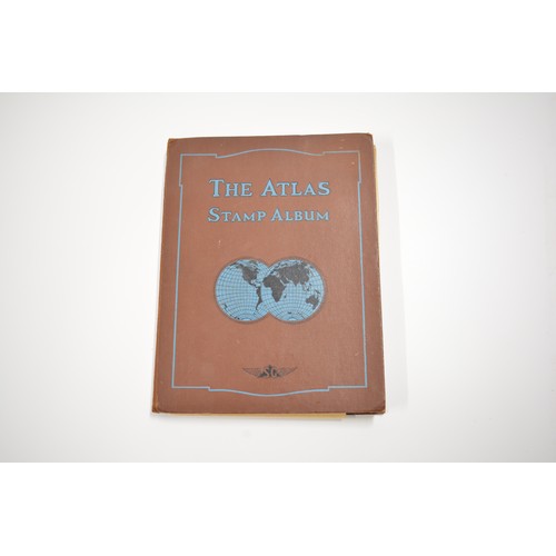 98 - Stanley Gibbons 'The Atlas' album containing various stamps ranging in dates to including Great Brit... 