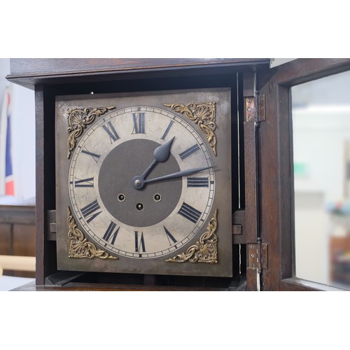 109 - Antique Long case clock with glazed panel with barley twist design, opens to a silvered /black dial,... 