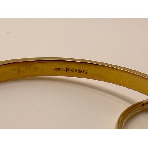 192 - 9ct gold bangle with decorative engraved design hallmarked Chester, 9.65g, together with one other 9... 