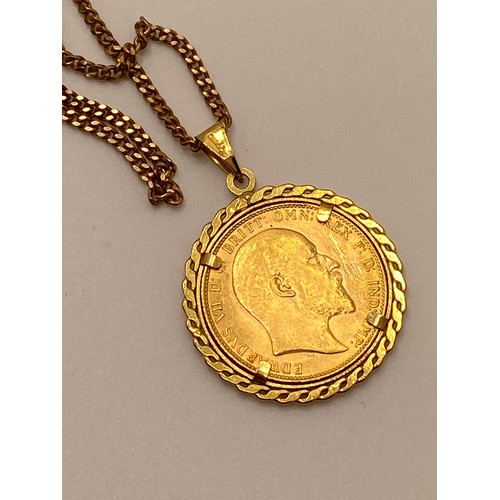 196 - 22ct gold full sovereign Edward VII 1907, in removable 9ct gold mount and chain stamped 9ct. Approx ... 