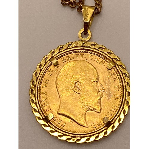 196 - 22ct gold full sovereign Edward VII 1907, in removable 9ct gold mount and chain stamped 9ct. Approx ... 