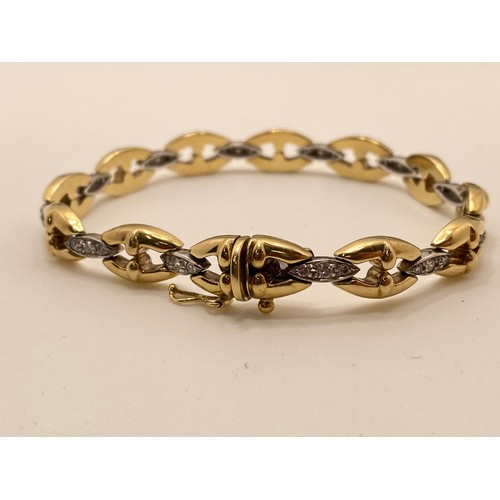 199 - 9ct gold and diamond bracelet, hallmarked 375. approx gross weight 14.5g. AF.