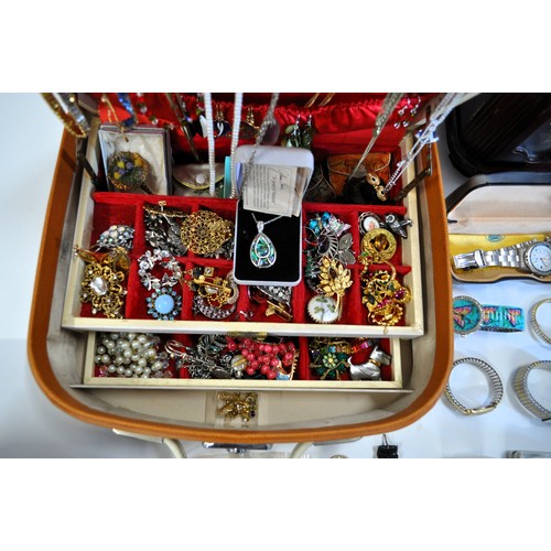 203 - A large collection of costume jewellery to include some pearl earrings marked 14k, watches, vanity c... 