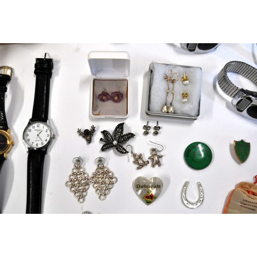 203 - A large collection of costume jewellery to include some pearl earrings marked 14k, watches, vanity c... 