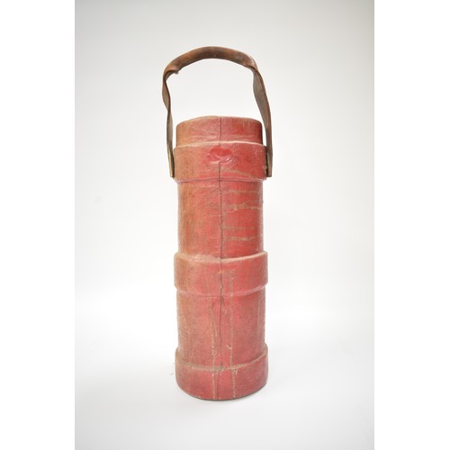 90 - Antique military armorial shell case carrier. made of cork covered in red leather with a leather car... 