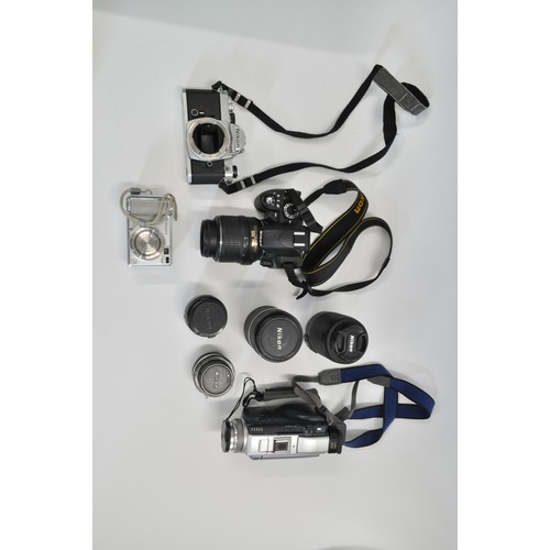 40 - Nikon D3100 Camera with additional len, one other Nikon camera, Sony camcorder, bags and accessories... 