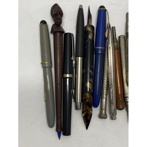 49 - A collection of fountain pens and pencils, including a Parker pen with 14k gold nib.