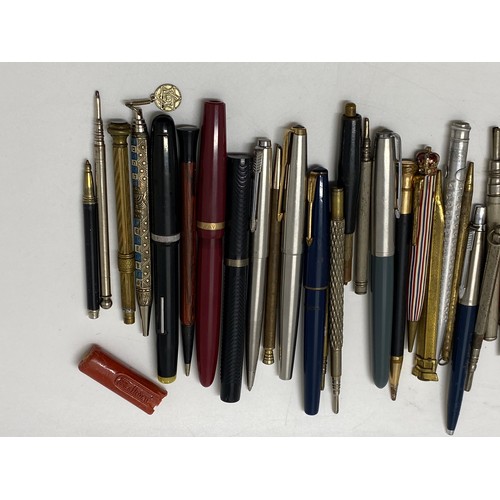 49 - A collection of fountain pens and pencils, including a Parker pen with 14k gold nib.