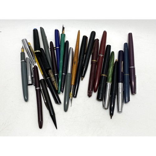 49 - A collection of fountain pens and pencils, including a Parker pen with 14k gold nib.