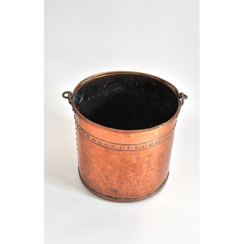 72 - Victorian copper coal/log bucket with rivet trim, brass handle, height 31cms