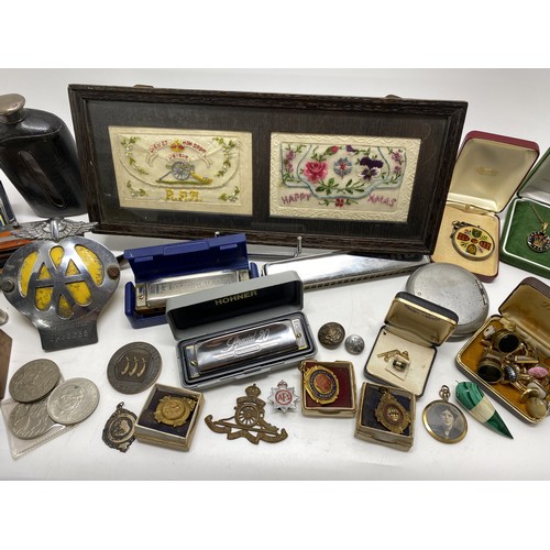 89 - Mixed ephemera consisting of badges, medallions, harmonica/mouth organs, hip flask, cufflinks, pen k... 