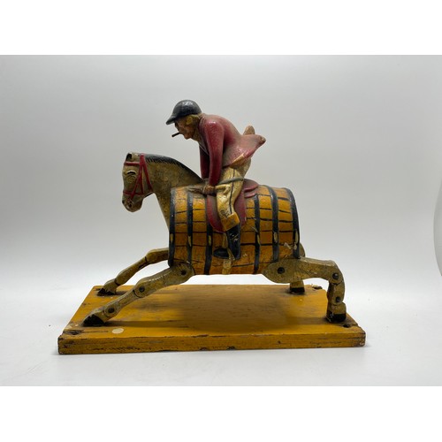 129 - Breweriana Interest -   Painted huntsman riding hobby horse with barrell body design, believed to be... 