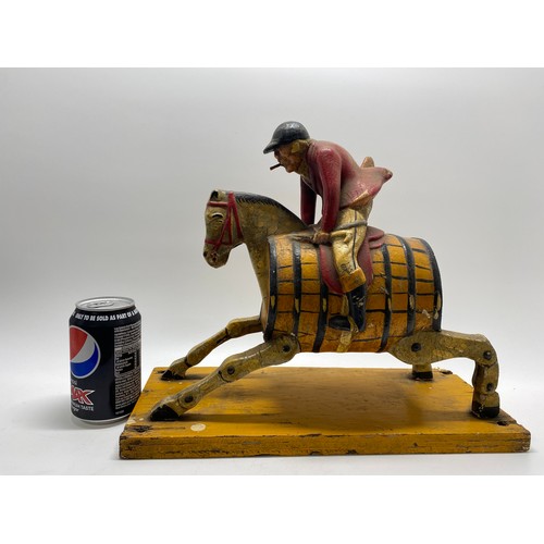 129 - Breweriana Interest -   Painted huntsman riding hobby horse with barrell body design, believed to be... 