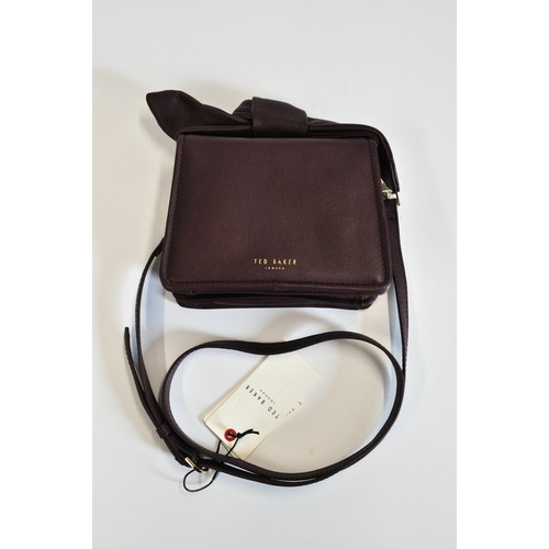 227 - Ted Baker handbag with a small purple bow. Crossbody, with labels and dustbag, new