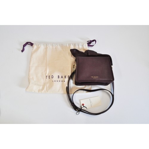 227 - Ted Baker handbag with a small purple bow. Crossbody, with labels and dustbag, new