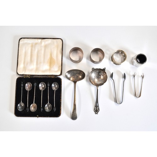 235 - Cased Coffee bean spoons hallmarked silver, a pair of silver napkin rings hallmarked Sheffield and o... 