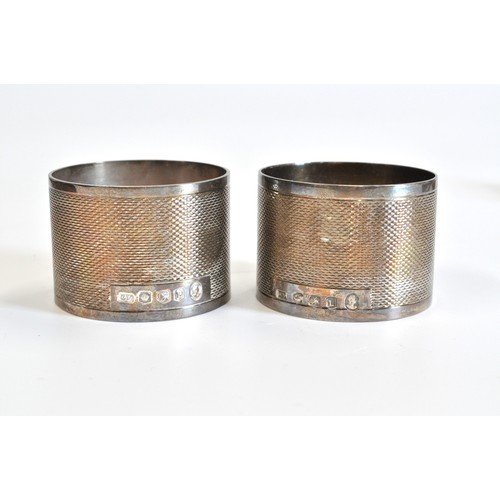 235 - Cased Coffee bean spoons hallmarked silver, a pair of silver napkin rings hallmarked Sheffield and o... 