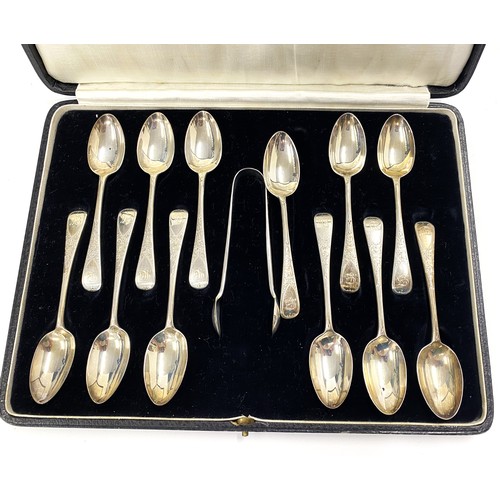 236 - A P Roger Cased set of x12 silver spoons with sugar tongs, decorative engraved flower design, MB mon... 