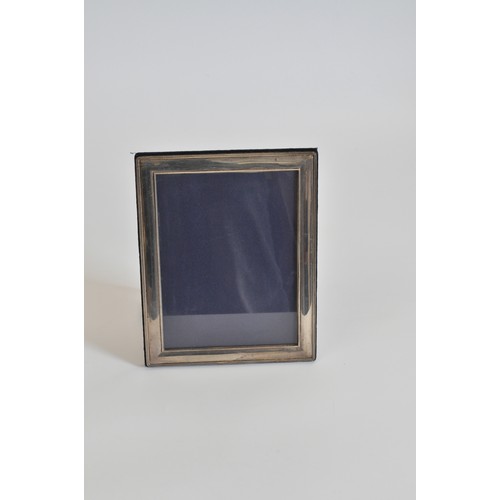 237 - Silver photoframe, hallmarked Sheffield, maker RC. approx L24cm x W19cm.