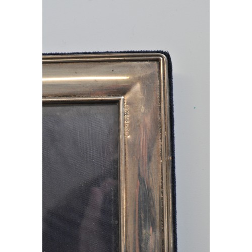 237 - Silver photoframe, hallmarked Sheffield, maker RC. approx L24cm x W19cm.