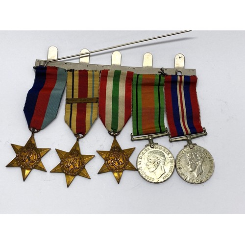 257 - WW2 medal bar containing x5 medals including The Africa Star 1st Army plus The Battle of Dunkirk 194... 