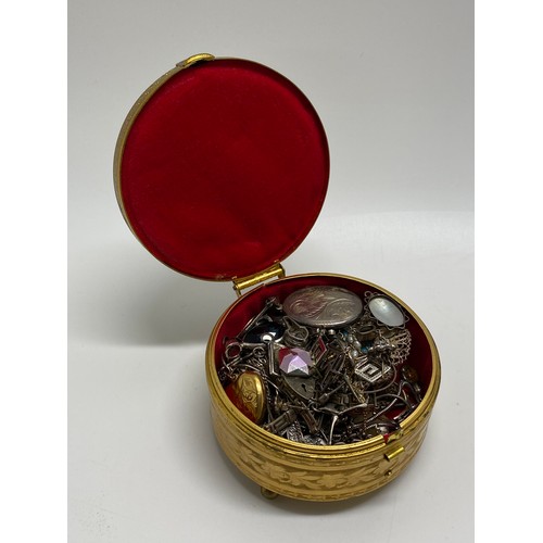 296 - Vintage box containing silver and other items of jewellery including lockets, bracelet, necklaces et... 