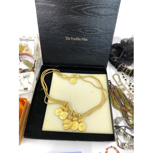 298 - A large quantity of mixed costume jewellery items including Franklin Mint boxed necklace, Debra Fox ... 