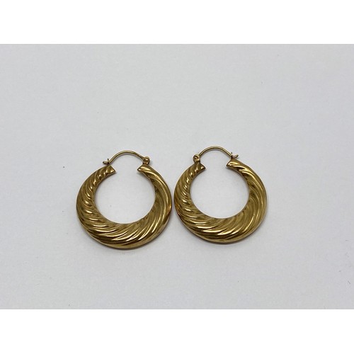 306 - A pair of yellow gold creole earrings stamped 375, weight 3.7 gms, overall length 38mm