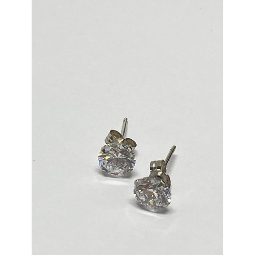 307 - A pair of 9ct white gold earrings with clear stones