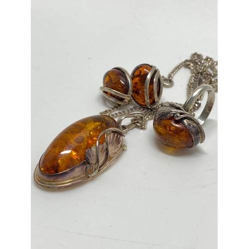 309 - Silver and amber pendant necklace, ring and earrings, stamped 925