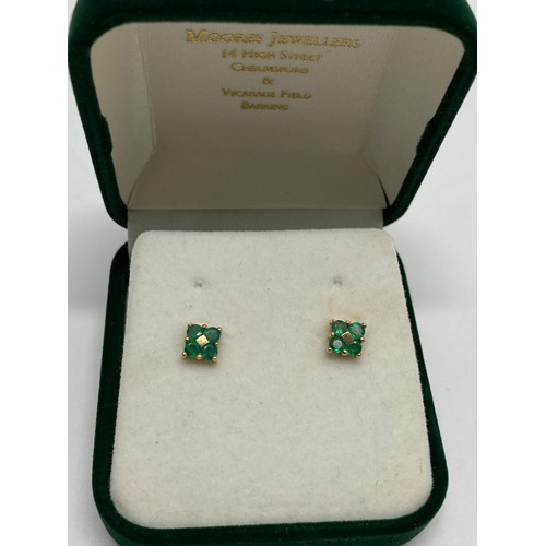 310 - A pair of 9ct yellow gold earrings with green stone in rectangular design, hallmarked 375