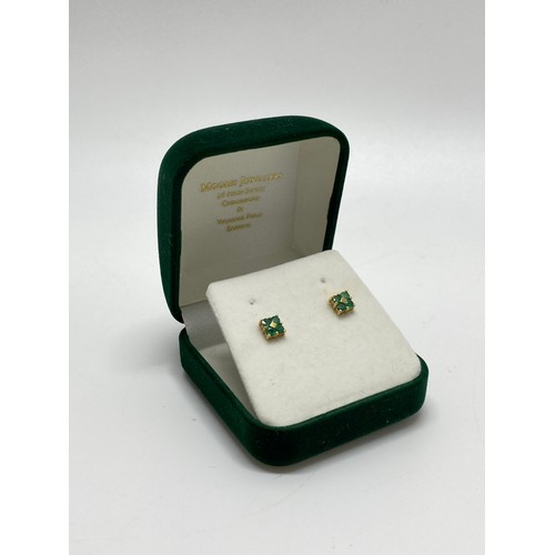 310 - A pair of 9ct yellow gold earrings with green stone in rectangular design, hallmarked 375