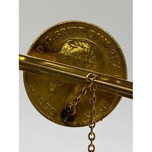 339 - 1911 gold (half) sovereign 9ct gold bar brooch with safety chain, gross weight 6.75 gms.AF