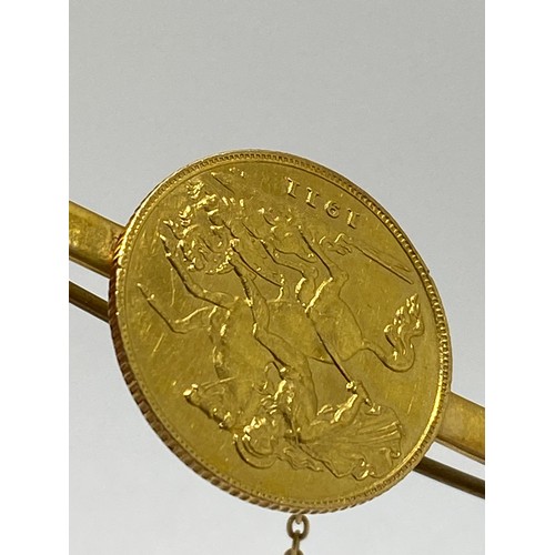 339 - 1911 gold (half) sovereign 9ct gold bar brooch with safety chain, gross weight 6.75 gms.AF