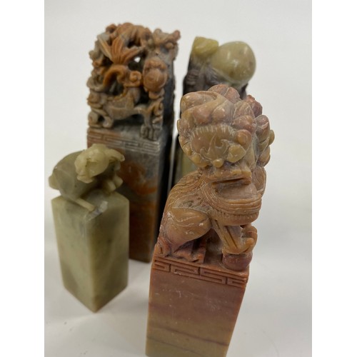 17 - A group of predominately oriental themed items consisting of snuff bottles, carved agate figures, va... 